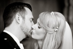 Bride and groom kiss for the first time as a married couple