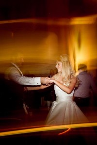 bride and groom dancing into the night