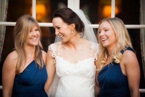bridesmaids and brides laughing with each other