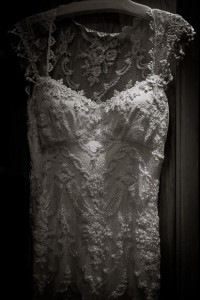 dramatic detail of elegant and ornate dress visible in beautiful light