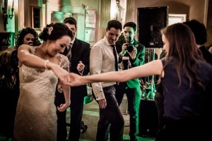 the bride shows her elegance while dancing with one of her wedding guests