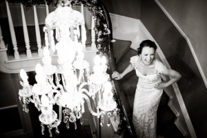 the lovely bride is laughing while standing on the staircase
