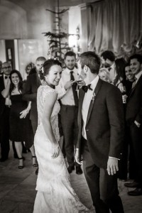 the lovely bride smiling at her groom as they enjoy their first dance together