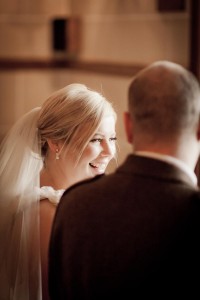 bride and groom laugh at wedding ceremony