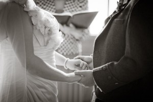 bride and groom hold hand and make vows