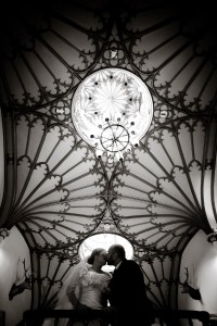 bride and groom kiss beneath ornate ceiling of dalhousie castle