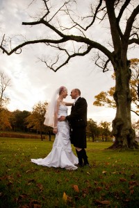 bride and groom with autumn trees