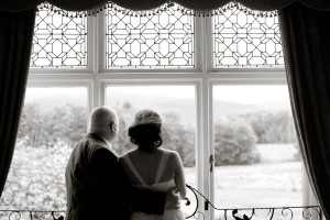 bride and father at window