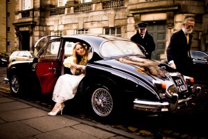 Bride steps out of classic car