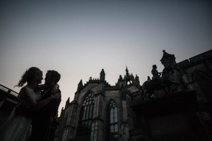 bride and groom outside saint giles cathedral, edinburgh at dusk