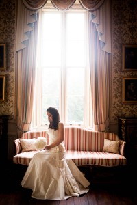 bride by window at drummuir castle