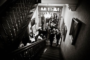 wedding guests from above with stairs at solsgirth house