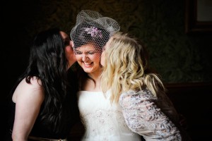 bride kissed by friends