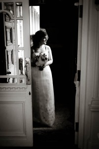 bride through doorway in black and white