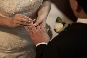 bride and groom exchange rings
