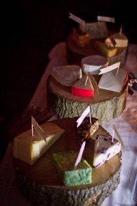 cheeses on slices on wood at wedding reception