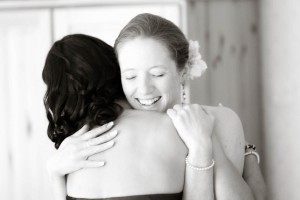 bride hugs bridesmaid