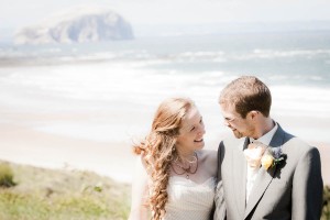 bride aand groom by sea at beach wedding