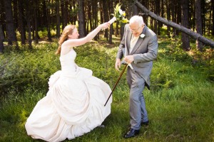 bride gets violent with bouquet at outdoor beach wedding