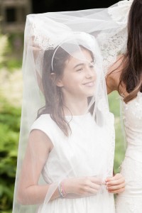 girl under bridal veil