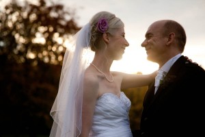 bride and groom in autumn sunset