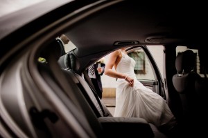 bride gets into wedding car