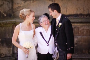 bride and groom get advice from grandmother