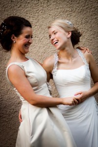 bride and bridesmaid laugh