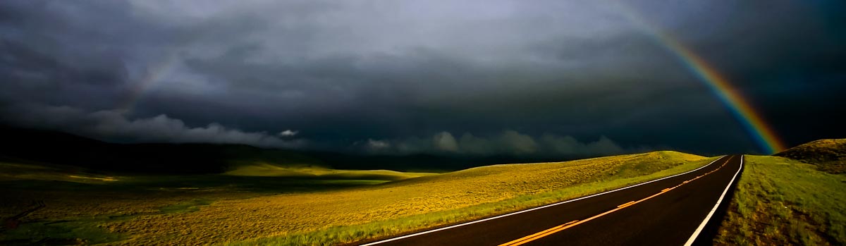 Montana Highway with rainbow going across