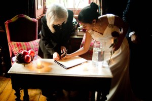 bride signing marriage register