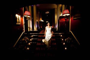 bride walks down stairs at prestonfield house in edinburgh
