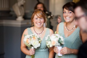 bridesmaids in blue dresses smiling at wedding in signet library edinburgh