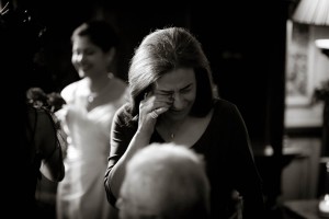 woman cries with joy at wedding
