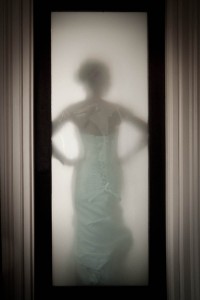 bride behind frosted glass
