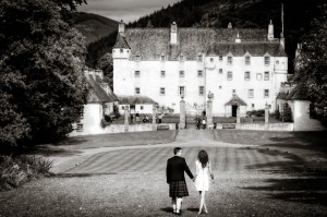 Bride and groom outside traquair house