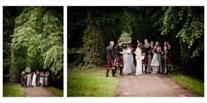 bride and groom walk in the woods with wedding party