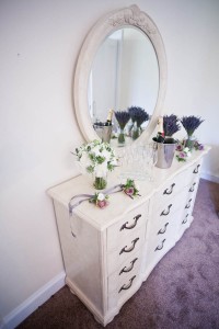 wedding flowers on dressing table with mirror
