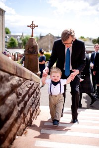 small boy arrives at wedding at church